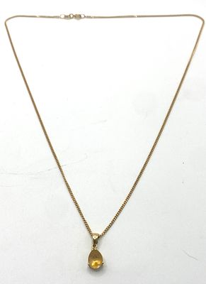 A 9ct yellow gold citrine pendant & chain, chain is 18 inches long, approx weight is 2.6 grams