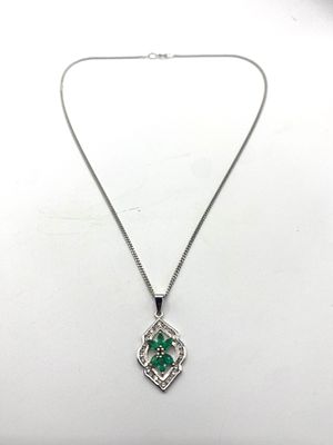 An 18ct white gold emerald pendant & a 9ct white gold 18 inch long chain, pendant is 2.2 grams 