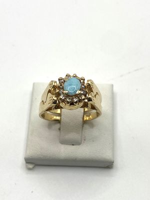 An 18ct yellow gold universal ring, turn table design with either amber or turquoise & diamond 