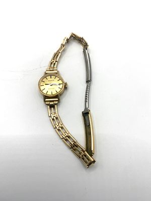 A 9ct yellow gold Tissot ladies watch, case is 9ct yellow gold, strap is rolled gold, working order