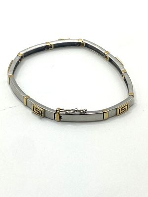 A 14ct yellow & white gold bracelet, 9.7 grams approx weight, the clasp will need some attention