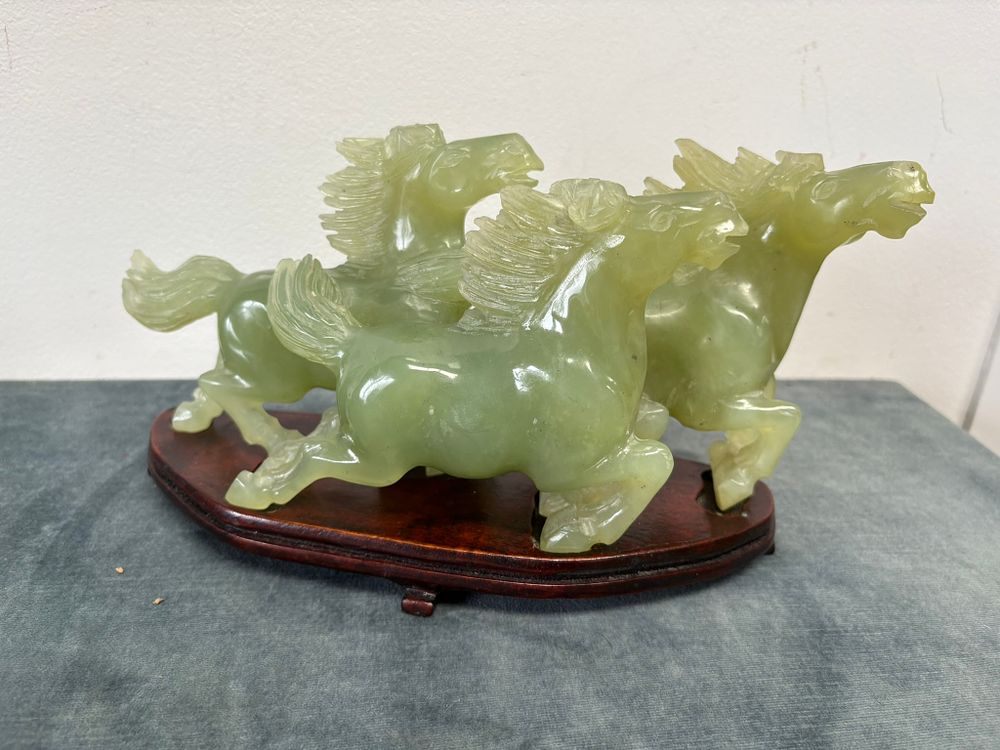 Lot 267: Carved jadeite figure of three horses running