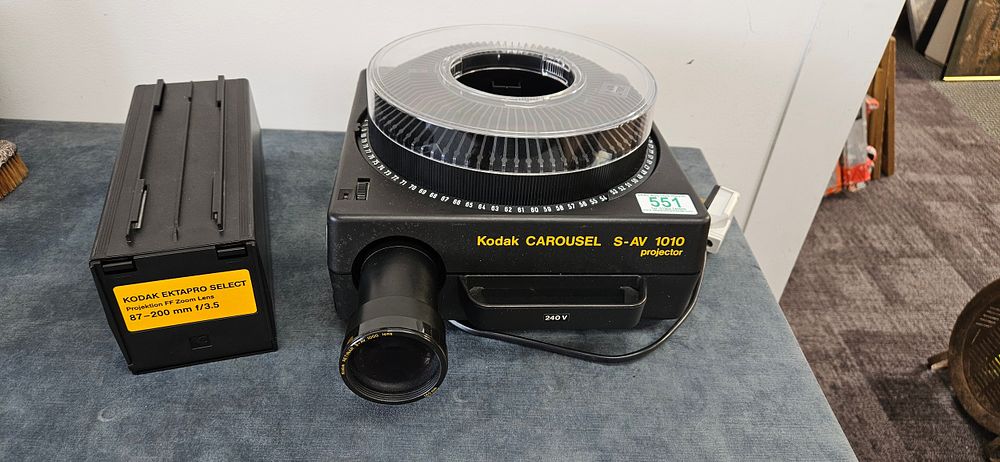 Lot 329: Kodak Carousel S-AV 1010 projector. Along with Kodak...