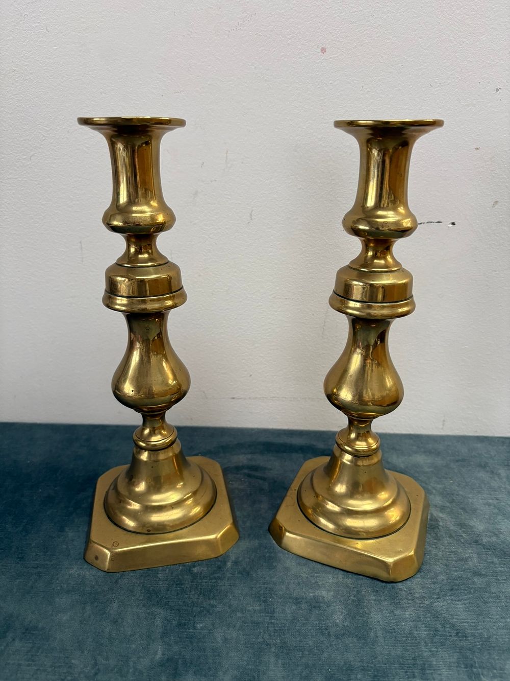 Lot 353: Pair of antique brass candlesticks
