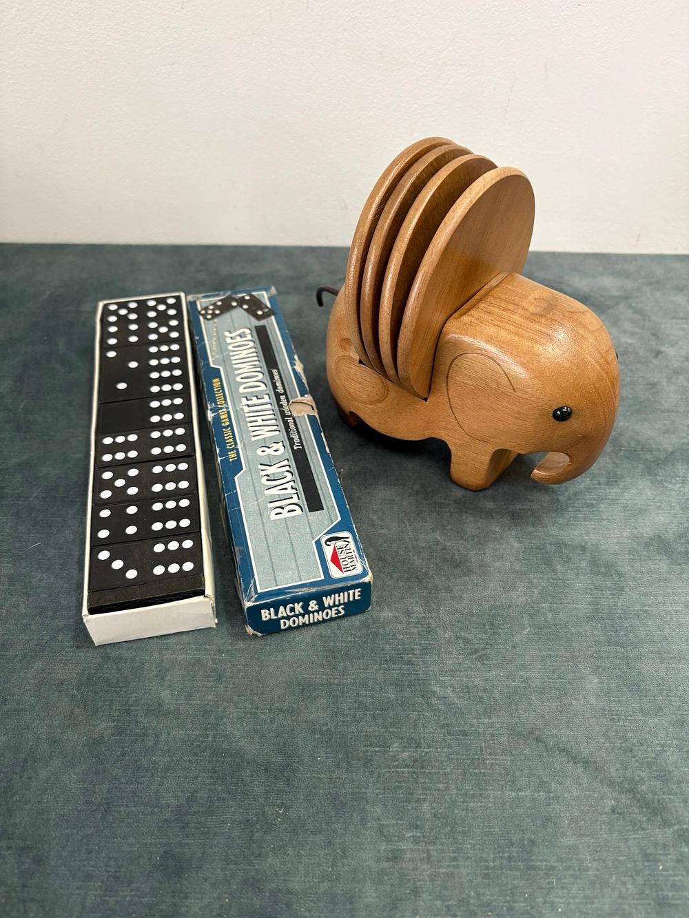 Lot 362: Black and white dominoes set and wooden elephant...