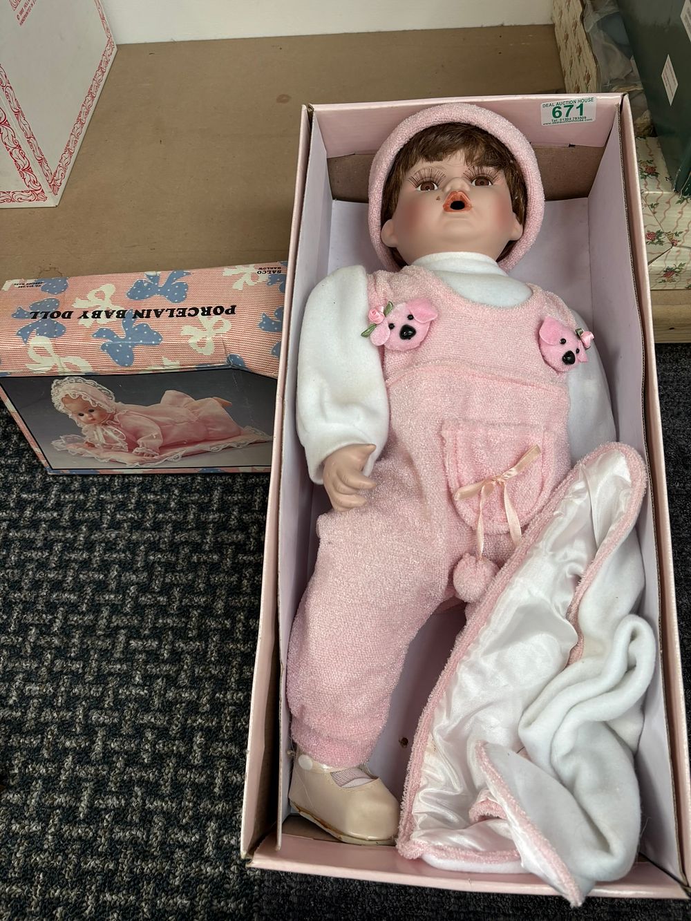 Lot 381: 1 x Large porcelain baby doll and one...
