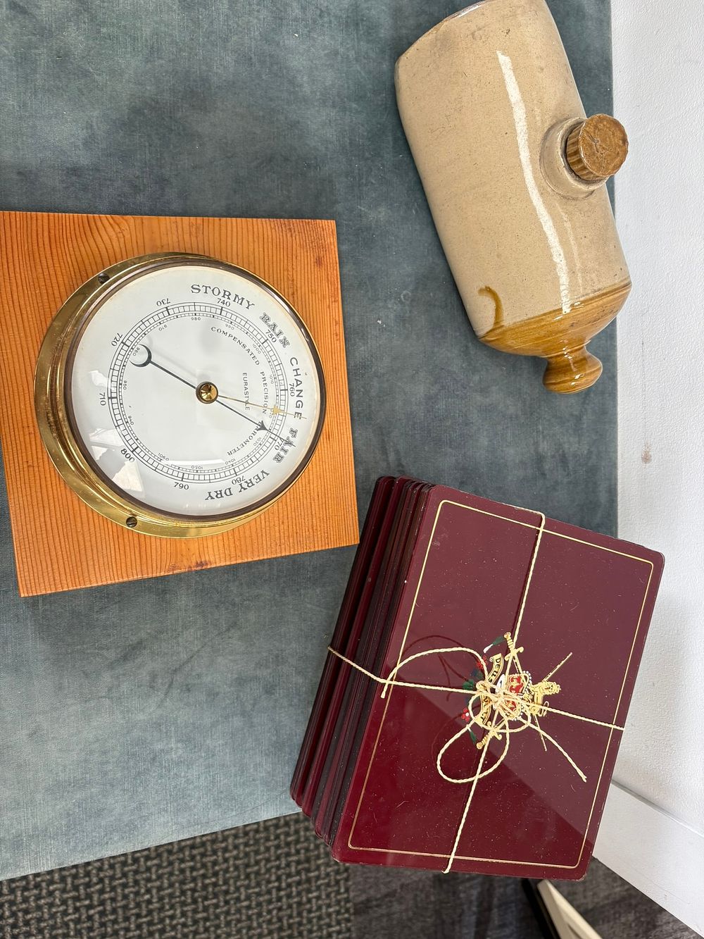 Lot 390: Wooden mounted barometer, placemats and water bottle