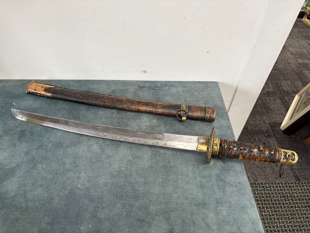 Lot 414: Samurai style Wakizashi, steel blade. Leather tsuba with...