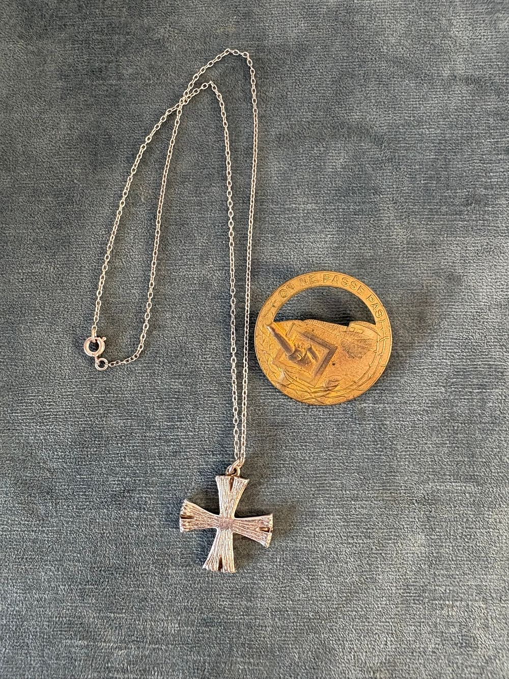 Lot 503: Silver wood effect cross necklace and pendant along...