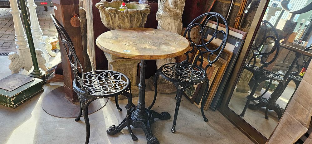 Lot 10: Heavy metal garden table and two chairs -...