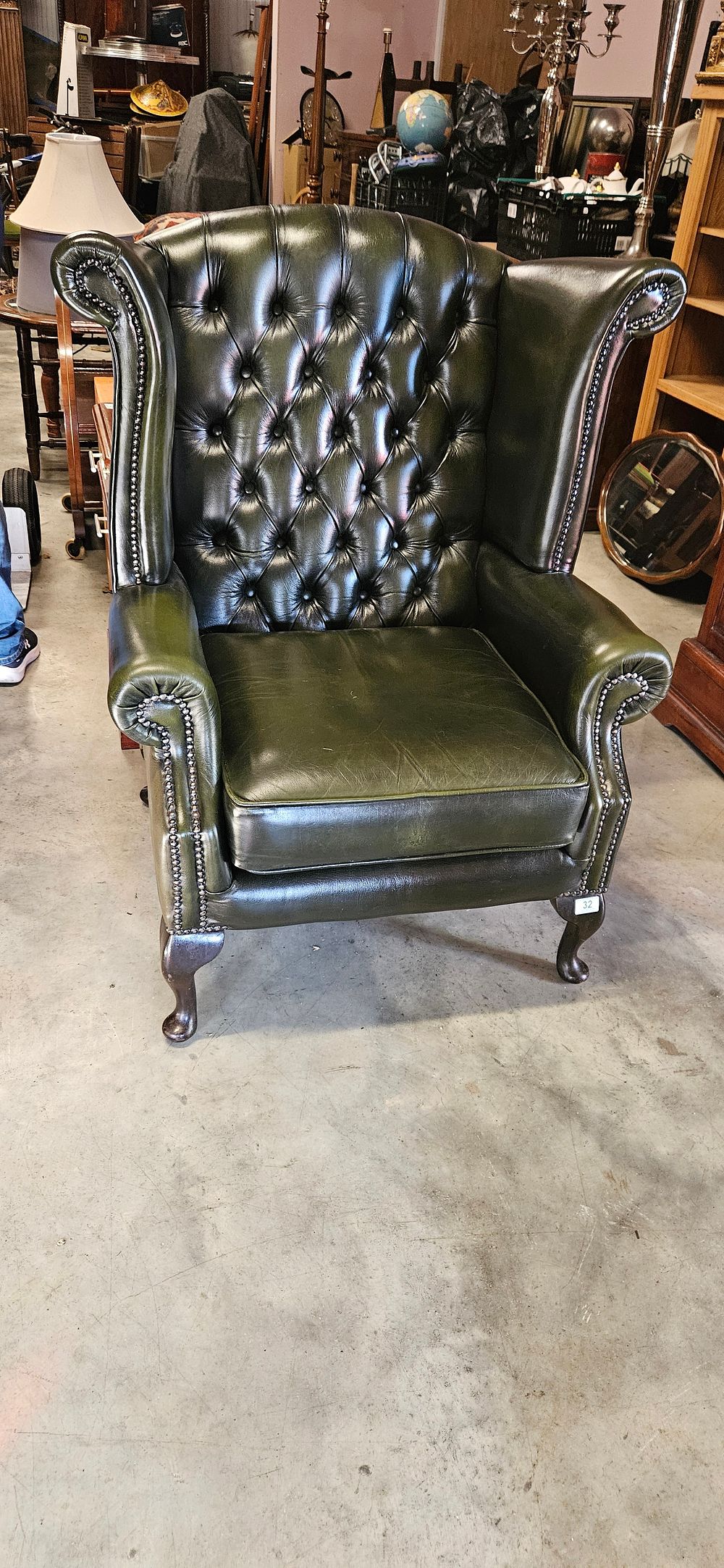 Lot 32: Chesterfield Queen Anne style high-back wing chair in...