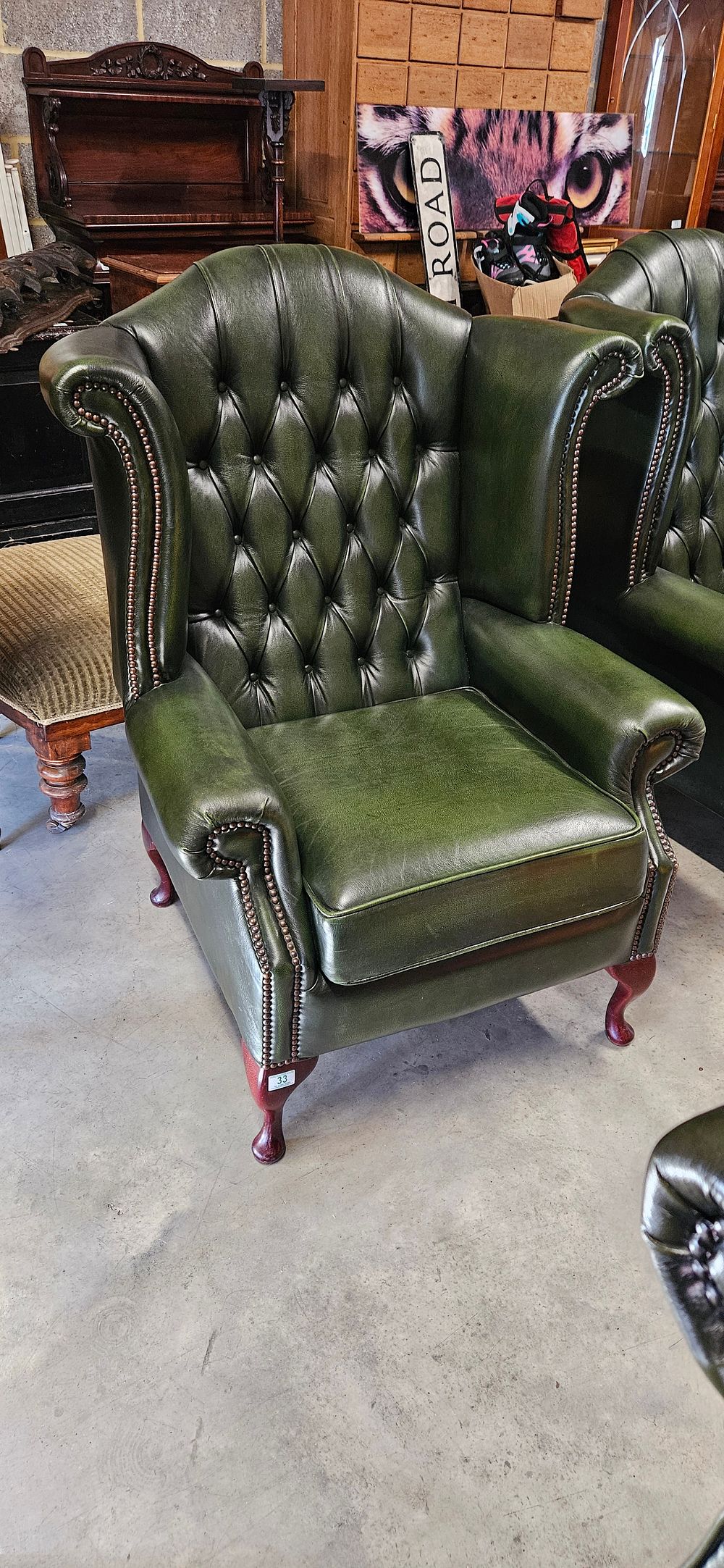 Lot 33: Chesterfield Queen Anne style high-back wing chair in...