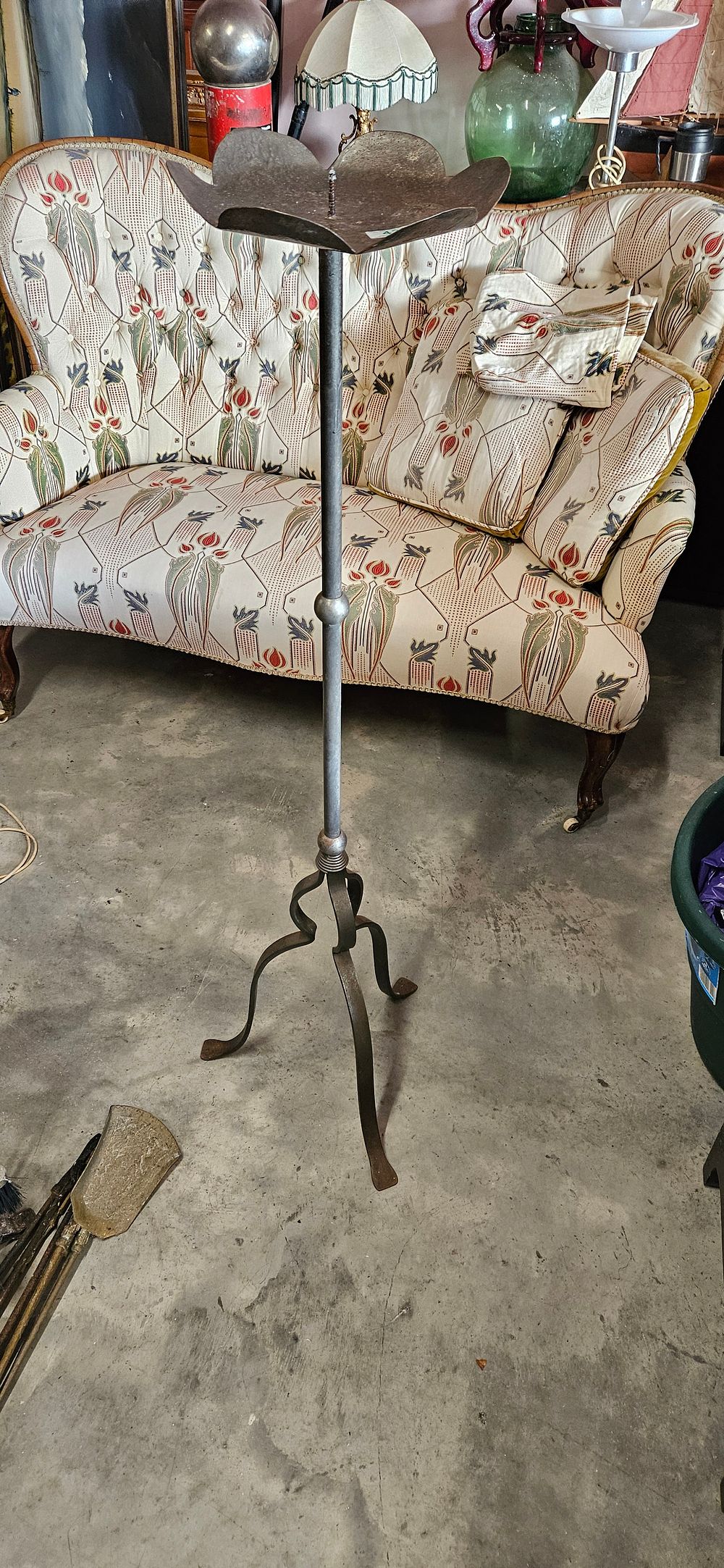 Lot 43: Tall metal candlestick