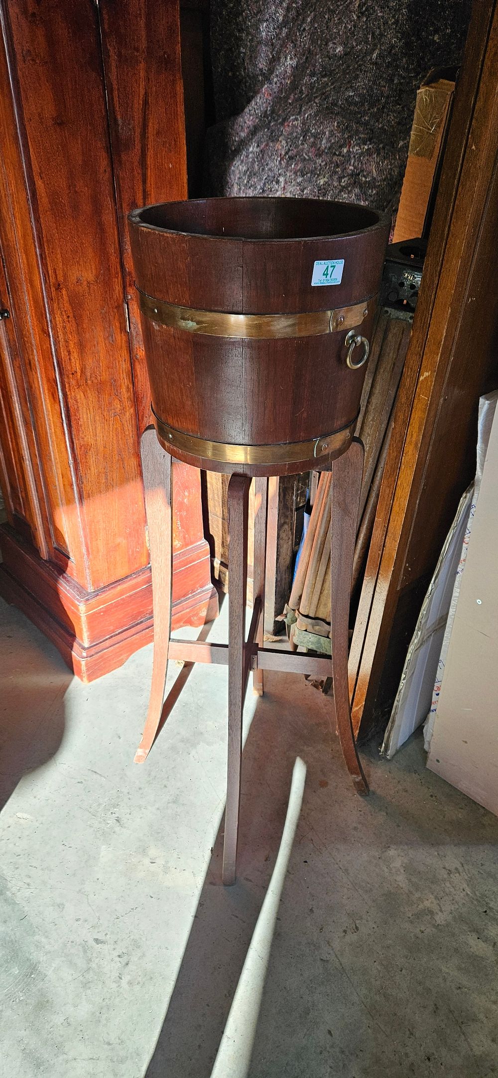 Lot 47: Hardwood and brass coopered barrel jardiniere stand