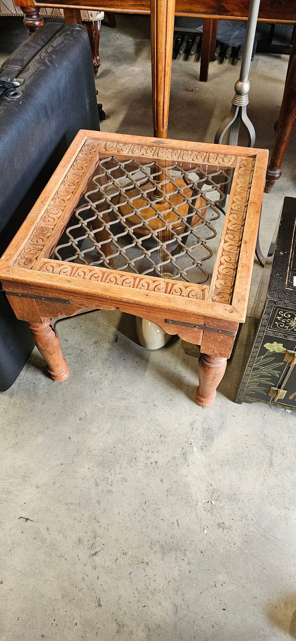 Lot 54: Heavy Indian hardwood and lattice metal coffee table...