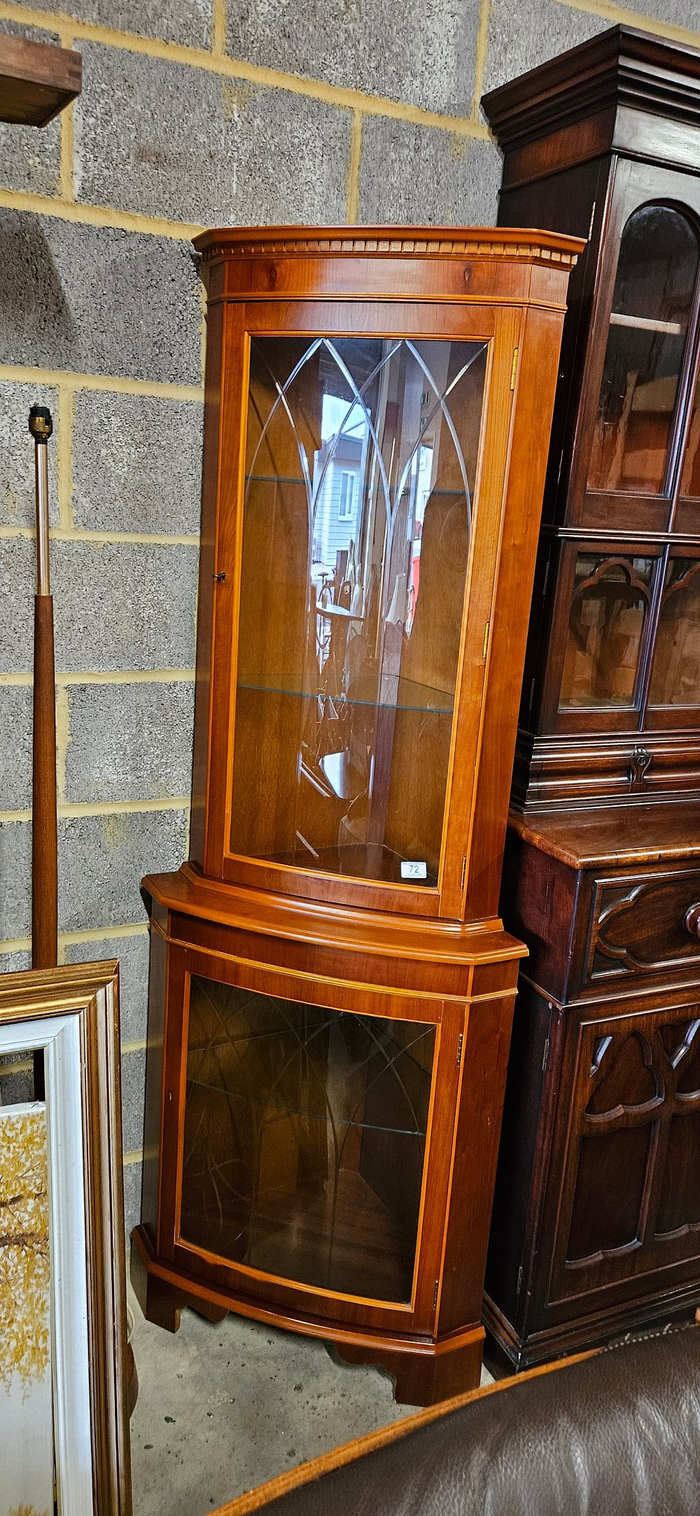 Lot 72: Vintage glass display corner unit. With key, etched...