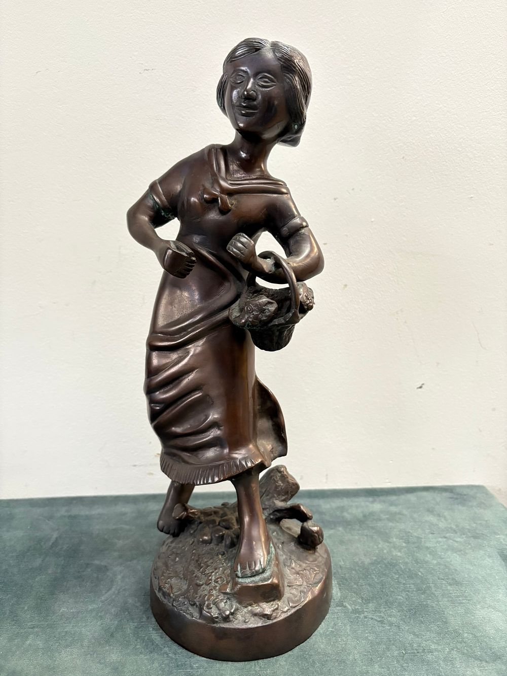 Lot 171: Bronze figure of a lady picking fruit -...