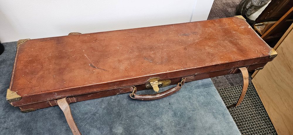 Lot 215: Antique leather brass bound shotgun gun case with...