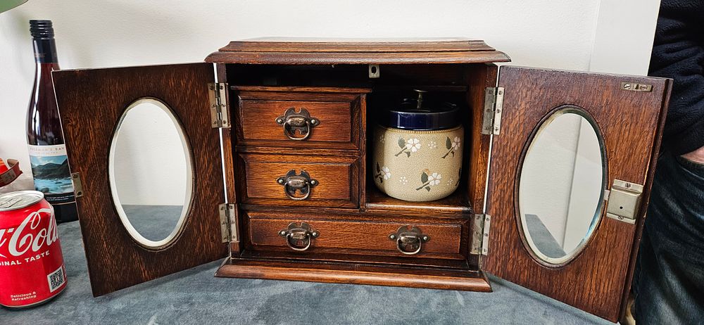 Lot 421: Antique oak tobacco/ smokers cabinet with drawers, bevelled...