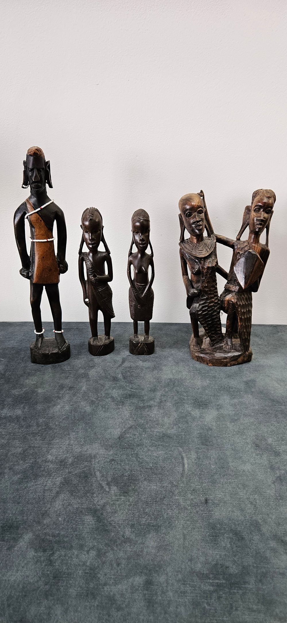 Lot 433: Collection of African carved wooden figures includes