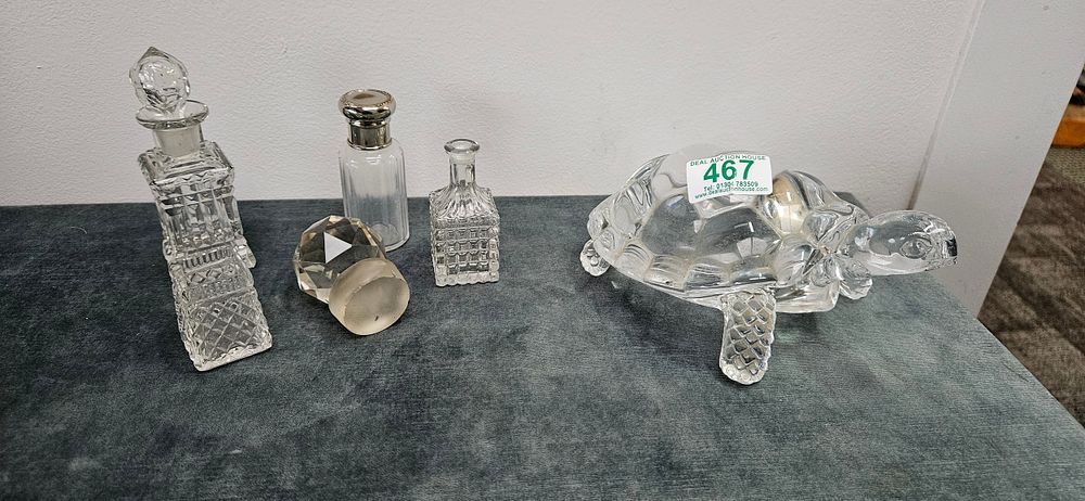 Lot 467: Glass tortoise and small glass perfume bottles/ lids