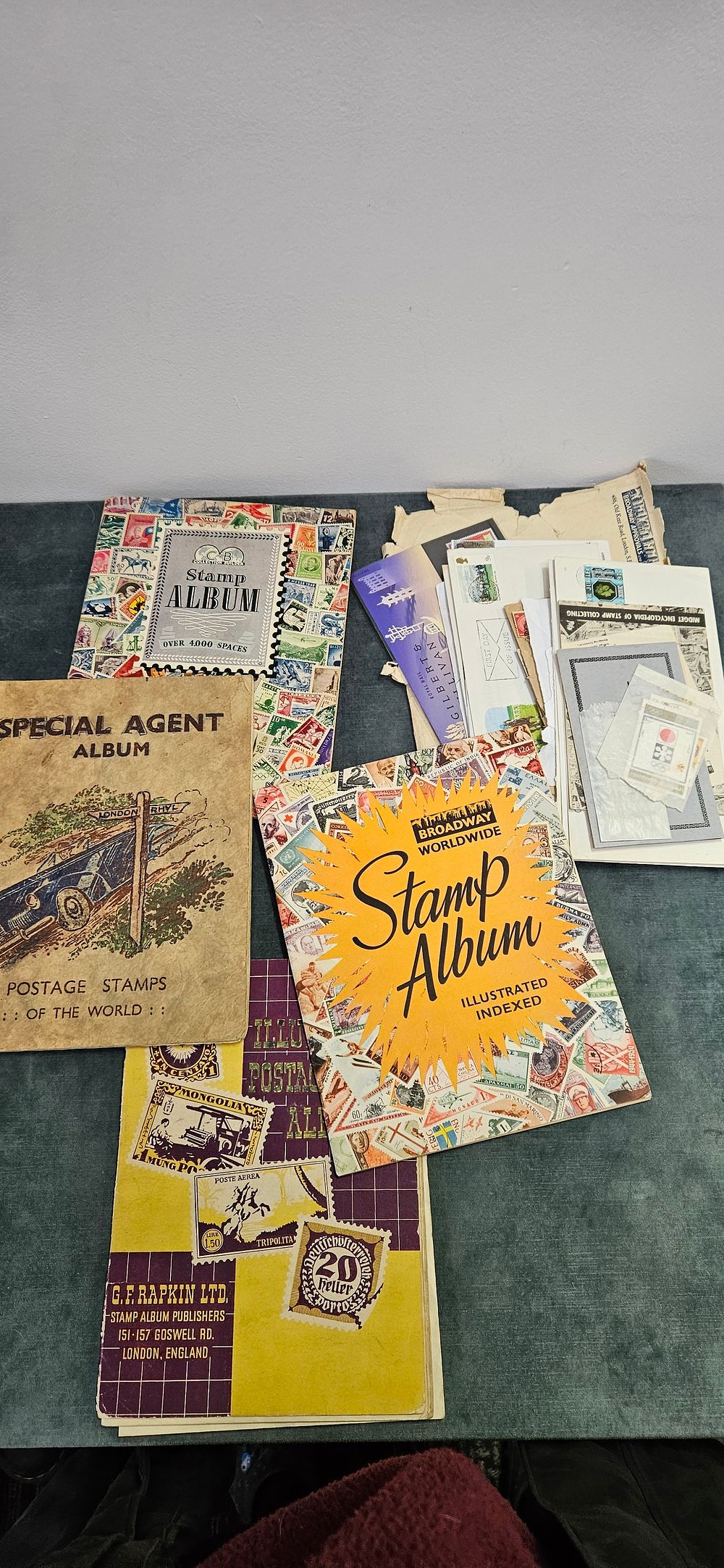 Lot 472: Collection of vintage stamps/ first day covers stuck...