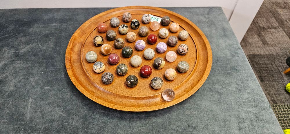 Lot 485: Semi-precious stone solitaire game with wooden circular board