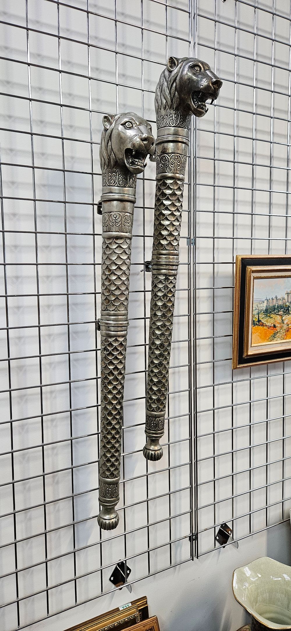 Lot 496: Pair of Indian gilded silver metal wall hangings/...
