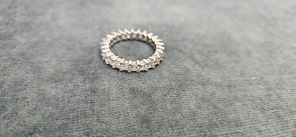 Lot 513: 14ct White gold eternity band with clear stones...