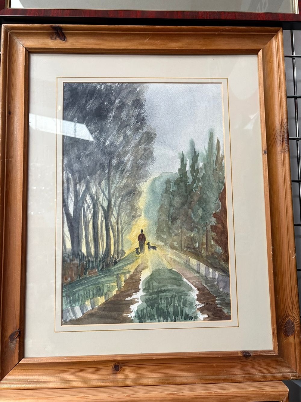 Lot 729: Watercolour in pine frame of forest signed M....
