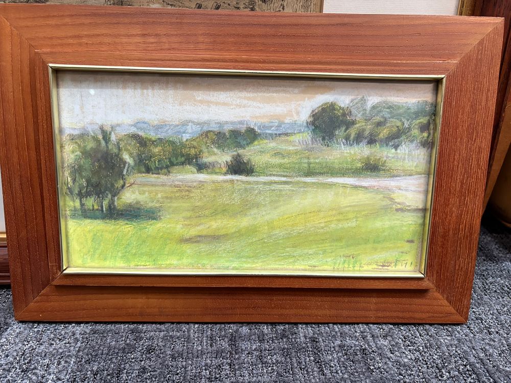 Lot 768: Small framed pastel? of fields and trees