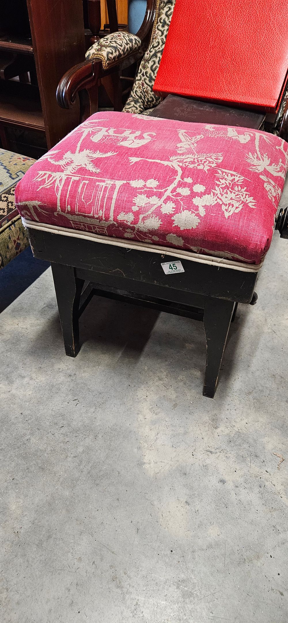 Lot 188: Upholstered black painted rise and fall piano stool