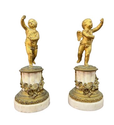 Putti. Pair of gilded bronzes on marble bases, 19th century, depicting putti. Dimensions: 33x13 