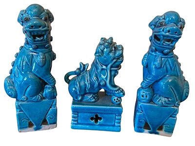 THREE TURQUOISE FU DOG FIGURINES. Three turquoise-glazed ceramic Fu Dog figurines, each with 