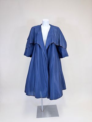 NAVY SILK TAFFETA SUMMER COAT, 1957. B 44", L 48", donor indicates unlabeled Pedro Rodriguez of 