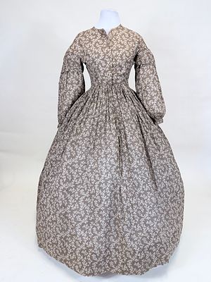 PRINTED COTTON DAY DRESS, 1851. B 36", W 31", scattered small holes, fading, wear to neckline 