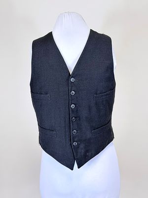 BLACK WOOL TWILL MEN'S WAISTCOAT, EARLY 20TH C. CH 34", W 31", wear to underarms, seam opening 