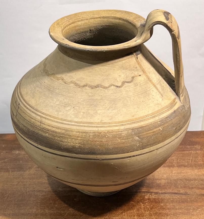 A South Italian Terracotta Jug, ca. 400 BCE. 20.4 cm high with the handle. With linear and wavy 