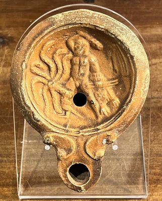 A Roman Terracotta Oil Lamp, 2nd century CE. 11.0 cm. Depicting Hercules confronting Hydra (The 