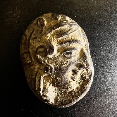 An Athenian Silver Drachm (Probably minted in Gaza). . Early 4th century BCE. 3.64 gr. Obv: Head 