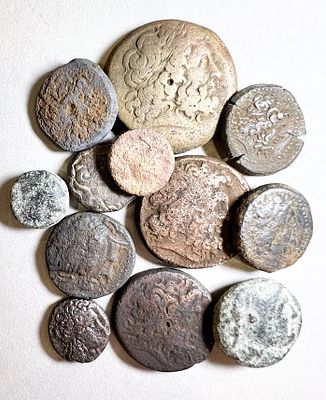 A Lot of 12 Ptolemaic Bronze Coins, 4th - 2nd century BCE. Of different types and 