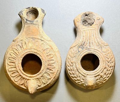 A Lot of 2 Roman Terracotta Oil Lamps. 1st - 2nd century CE.10.1 and 9.0 cm. Decorated with 