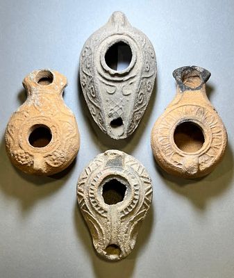 A Lot of 4 Terracotta Oil Lamps. Roman, Byzantine and Early Islamic, 1st - 6th century CE. 9.8 