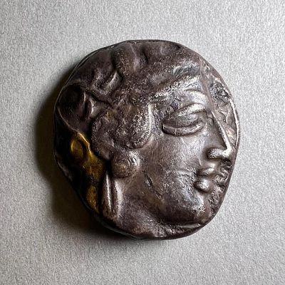 An Athenian Silver Tetradrachm. Late 5th century BCE. 17.0 gr. Obv: Head of Athena. Rev: Owl 
