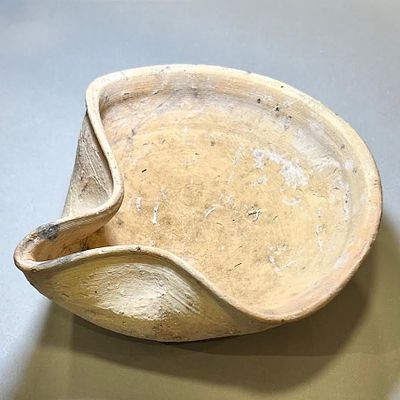 A Terracotta Oil Lamp. Iron Age, 1200 - 586 BCE. 13.6 cm in diam. In very good condition.