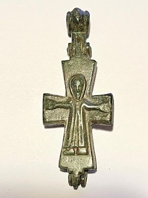 A Bronze Cross Pendant Reliquaria. . 4th-8th century CE. 6.0 cm high. Depicting on one side the 