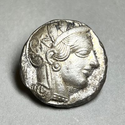 An Athenian Silver Tetradrachm. 5th century BCE. 17.16 gr. Obv: Head of Athena. Rev: Owl 