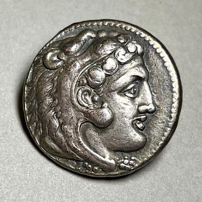 A Silver Tetradrachm of Alexander the Great, 336 - 323 BCE. . 16.40 gr. Obv: Head of Alexander 