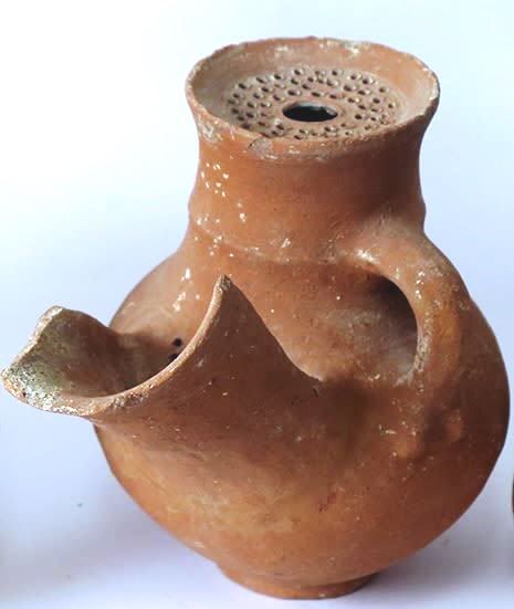 A Terracotta “Beer” Jug. Iron Age II, 8th-7th century BCE. 16.8 cm high. With perforated mouth 