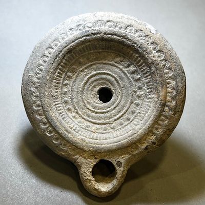 A Roman Terracotta Oil Lamp. 1st - 2nd century CE. 9.0 cm. With an ancient crack at the bottom. 